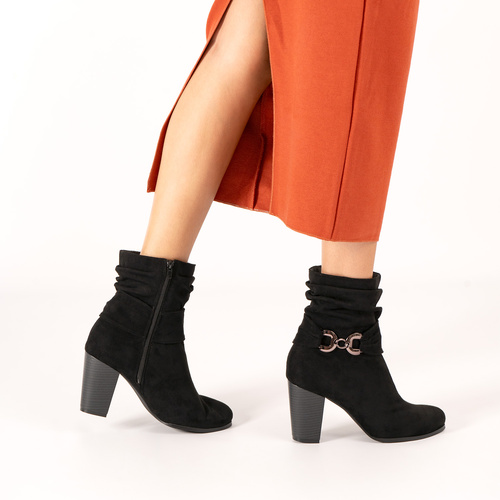 Heeled booties in grey black suede material 