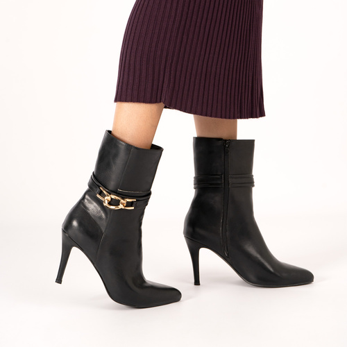 Heeled booties in soft black faux leather 